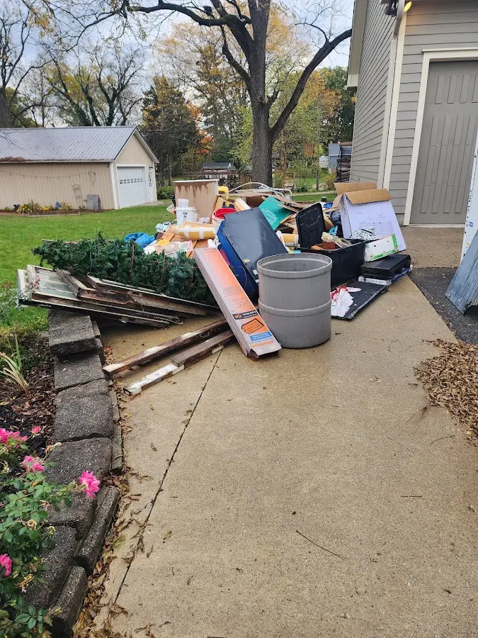 Dumpster being loaded with debris for Estate Cleanout Dumpster Rental in Reynoldsburg